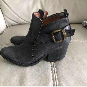 Jeffrey Campbell distressed black booties.